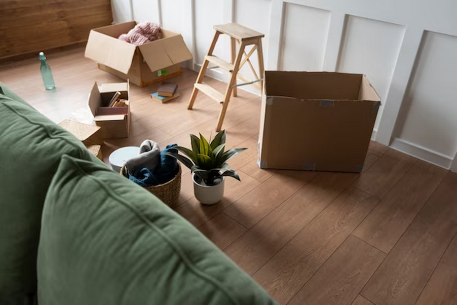 Various boxes and items within a vacant apartment.