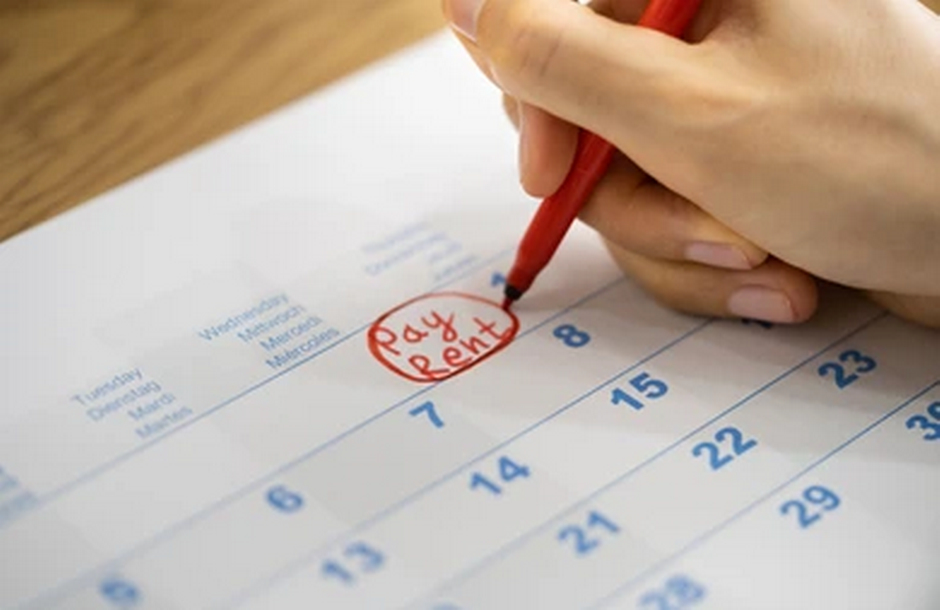 Handwritten Reminder on Calendar to Pay Rent