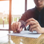 Man with a pen in front of documents